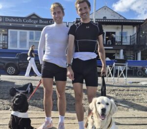 James and Miles pose with two dogs