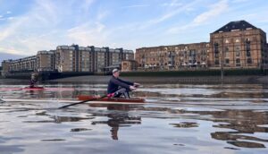 A single sculler (Archie) rows on the River Thames 